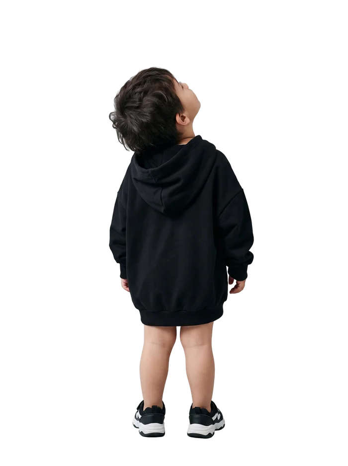 A small boy looking up at the frame from the gallery floor