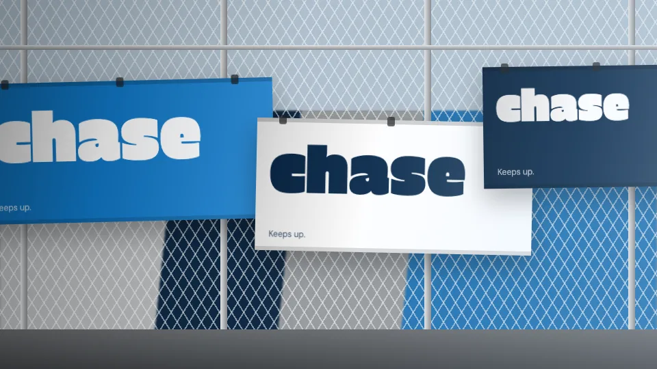 chase banners cable-tied to a chain-link fence